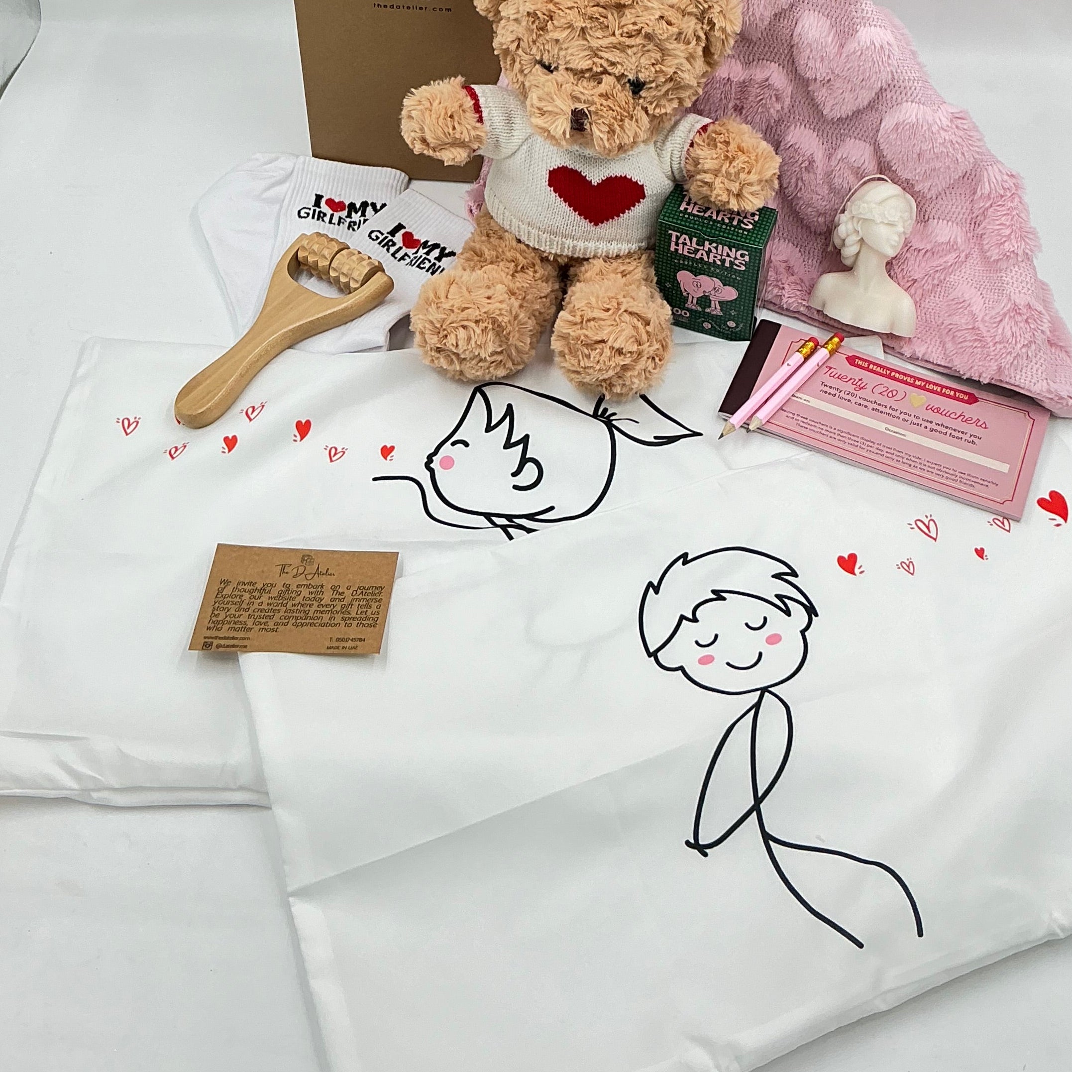 Teddy bear with heart sweater, pink furry pillow case, vouchers love care attention, talking hears cards
, pink pencils, 2 pillow cases girl and boy white, I love my girlfriend socks, body massage roller, candle woman shape