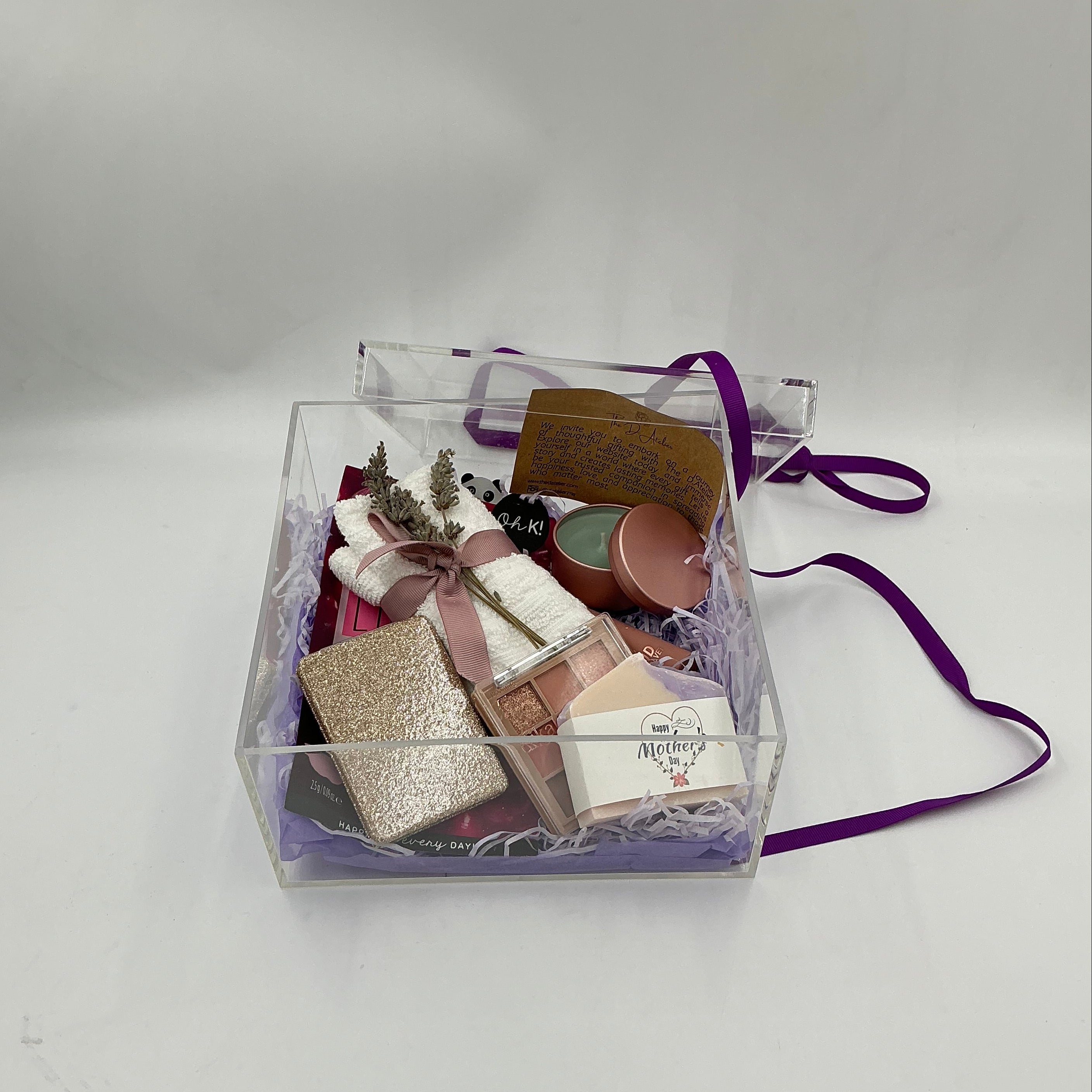 Clear plastic bag with cosmetic items on a white background