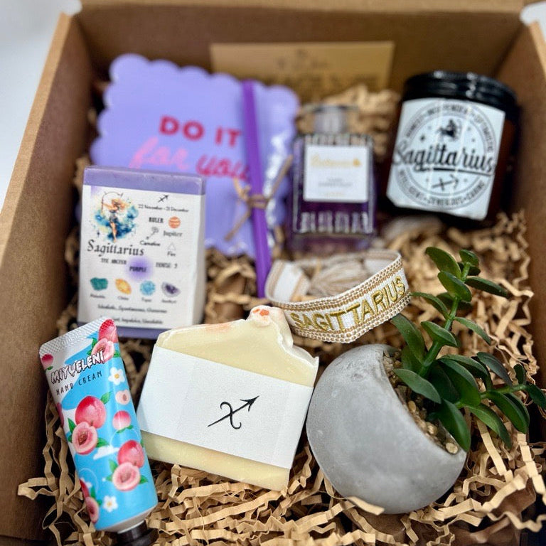 Sagittarius Gift box with various items including a soap, candle, and small plant