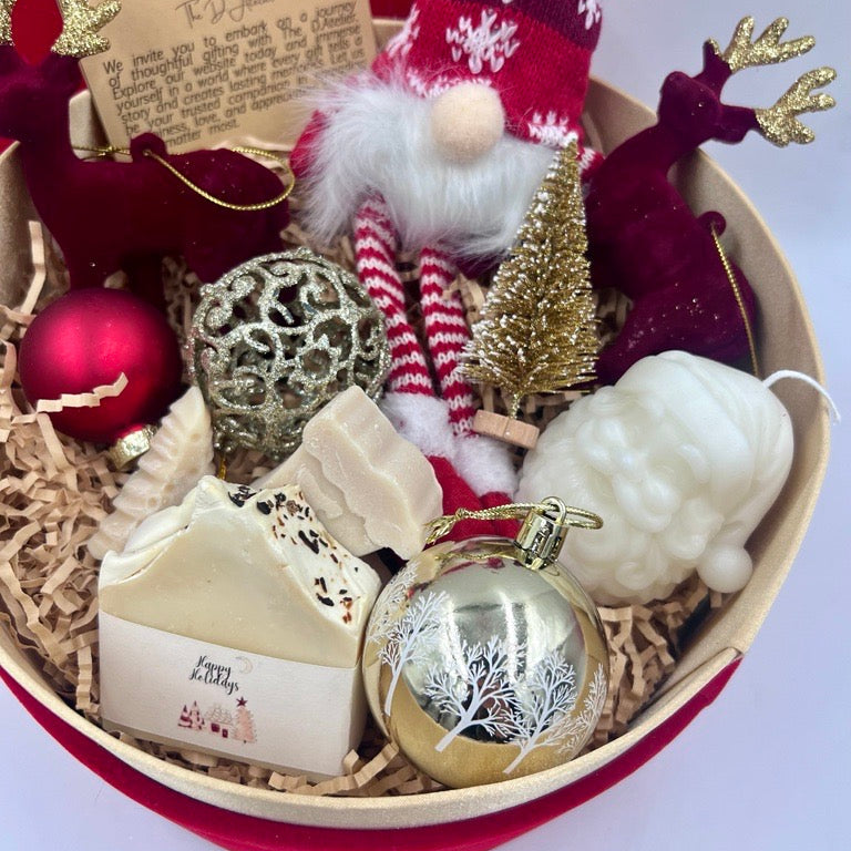 Decorative gift basket with Christmas-themed items including a gnome, ornaments, and a candle.