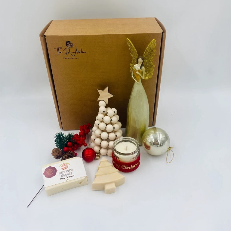 Box for Christmas that includes An angel, natural handmade soaps, ornaments, and candle