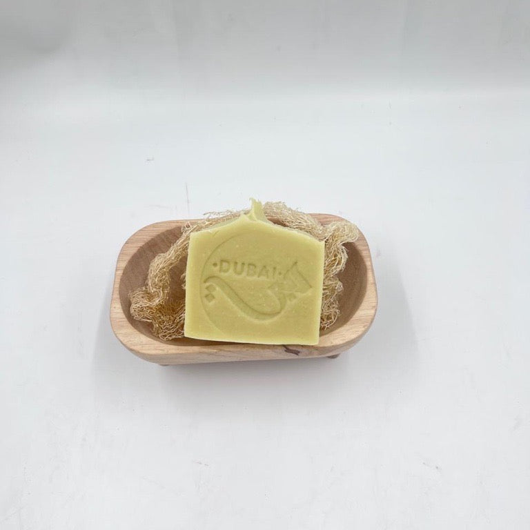 Soap bar with 'Dubai' branding in a wooden dish on a white background; Enjoy our pistachio Bliss Soap! The Dubai Soap!

Crafted with pistachio essential oil, coconut milk, and pure oils.

What soap is to the body, laughter is to the soul.