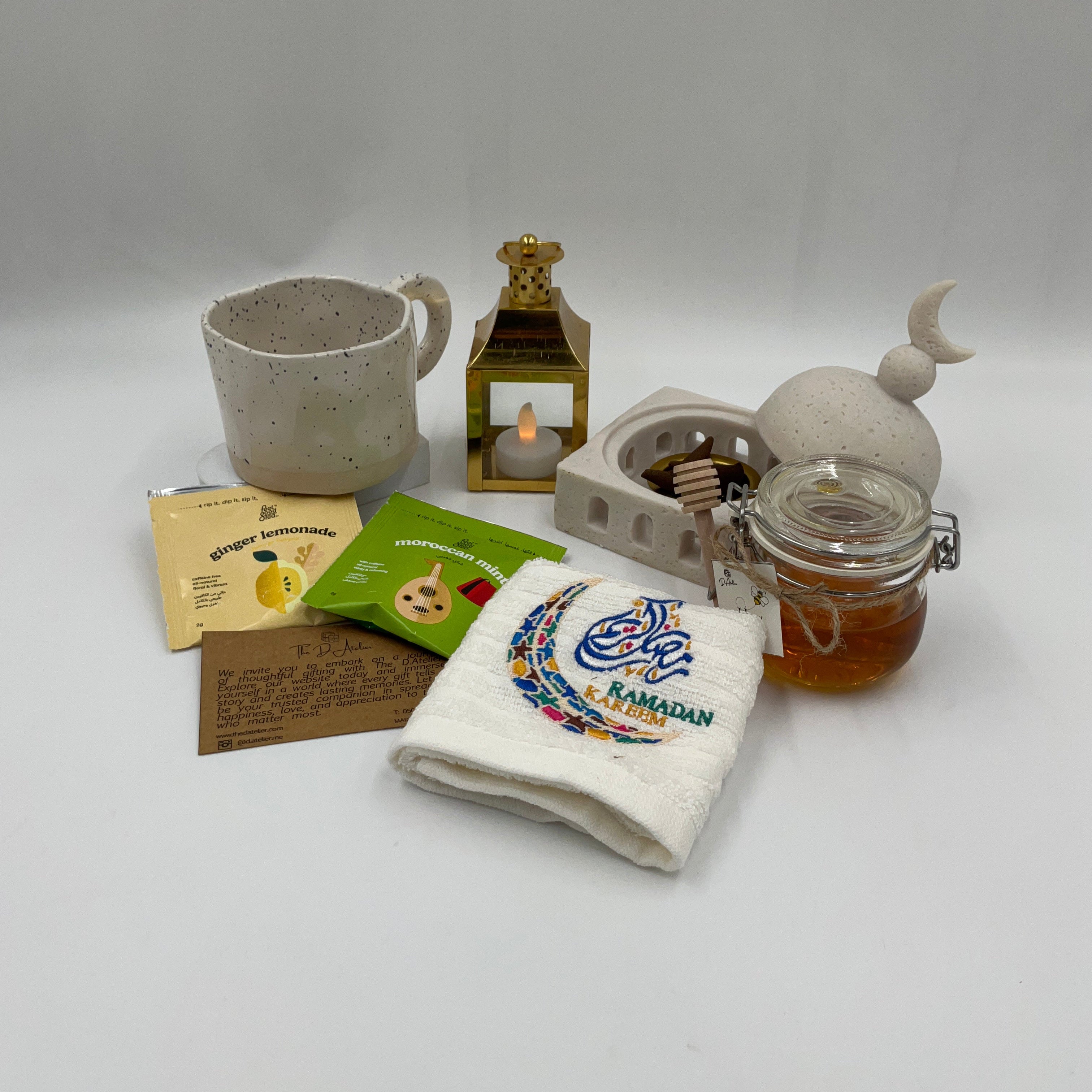 Ramadan Collection of decorative items including a teapot, jar, mug, and soap on a light gray background