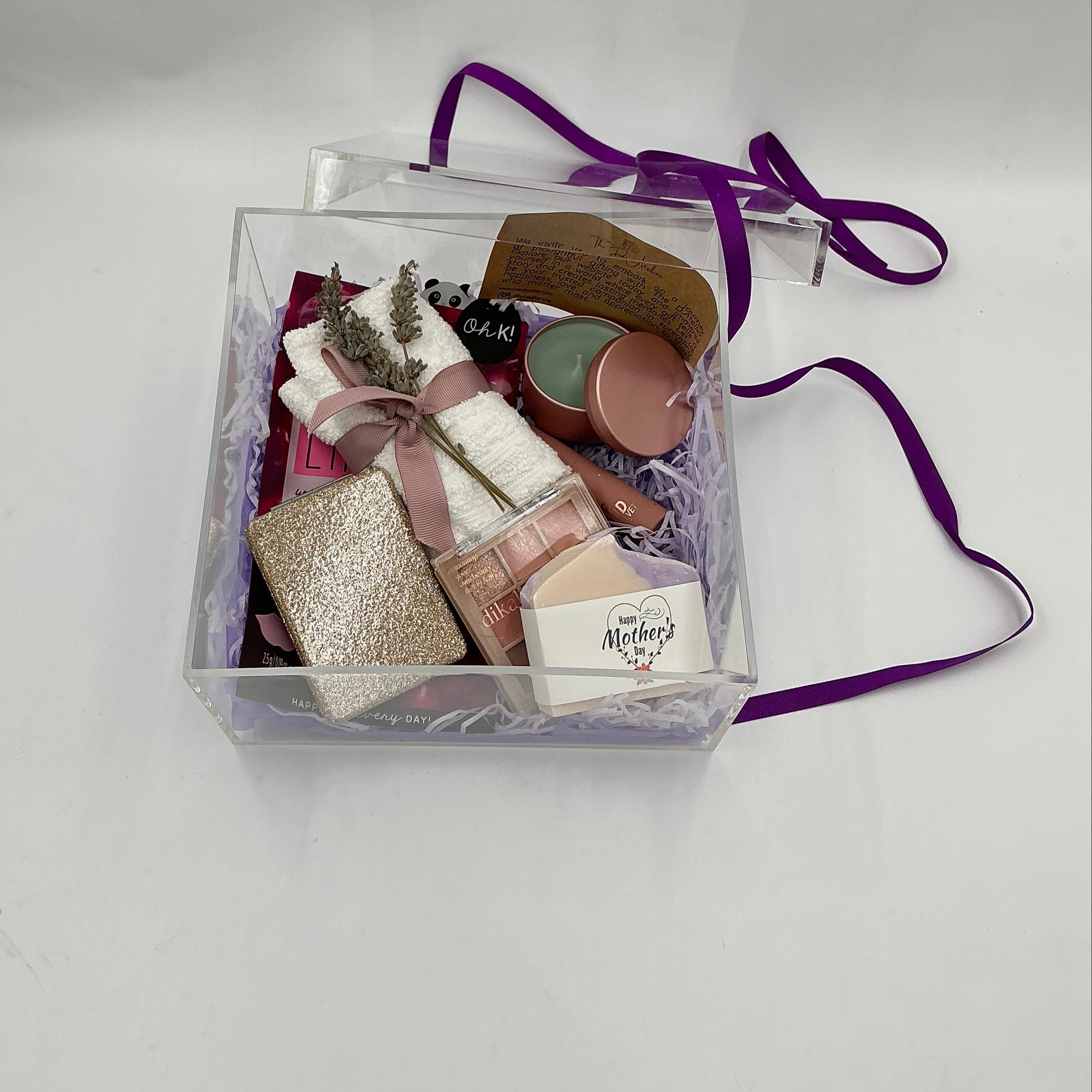 Clear gift bag with decorative items on a white background