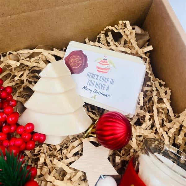 Box for Christmas that includes An angel, natural handmade soaps, ornaments, and candle 