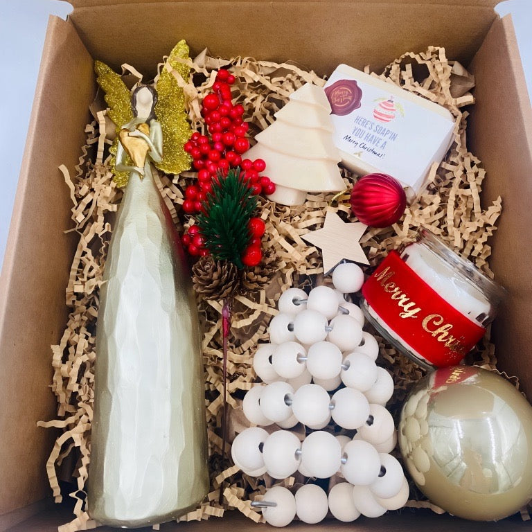 Box for Christmas that includes An angel, natural handmade soaps, ornaments, and candle 