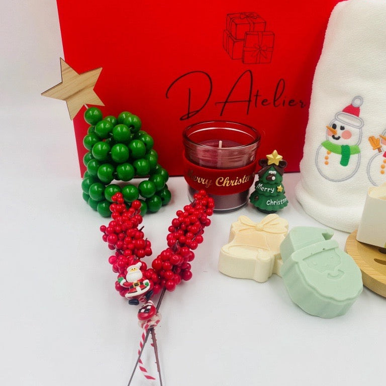 Christmas-themed items including a red box, candle, and decorative items, Christmas towel, natural handmade Soaps.