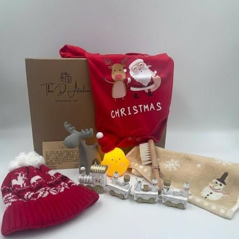 A Christmas gift box designed for the little one to enjoy as they celebrate their very first holiday season. Inside, you’ll find a charming assortment of items that are both practical and playful; baby's first Christmas. 