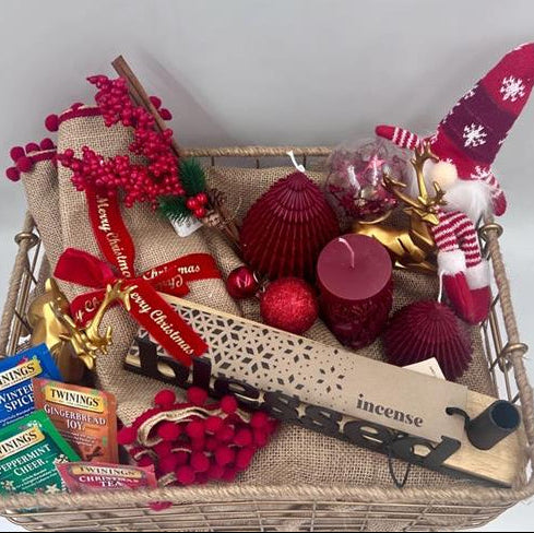 A Metal Hamper including metal incense burner, Christmas red candles, Christmas ornament, table festive runner, 4 tea sachet; gold reindeers