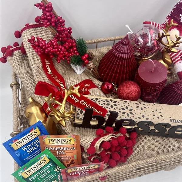 A Metal Hamper including metal incense burner, Christmas red candles, Christmas ornament, table festive runner, 4 tea sachet; gold reindeers