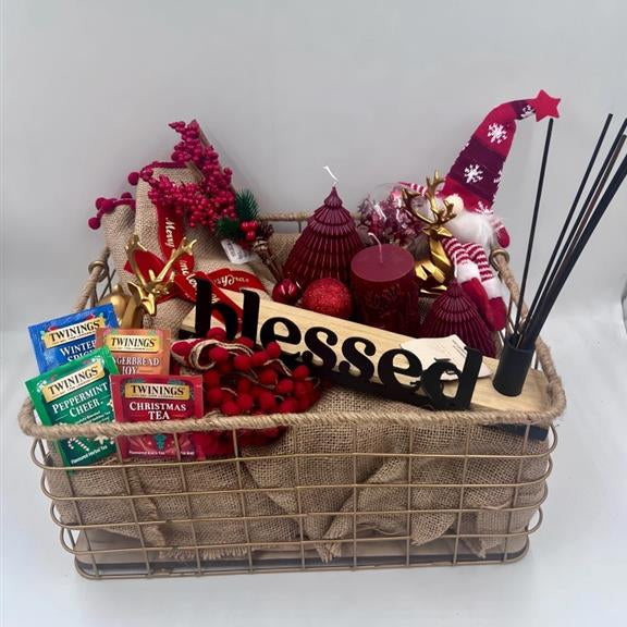 A Metal Hamper including metal incense burner, Christmas red candles, Christmas ornament, table festive runner, 4 tea sachet; gold reindeers