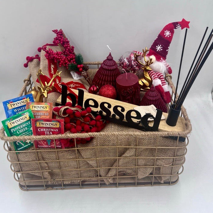 A Metal Hamper including metal incense burner, Christmas red candles, Christmas ornament, table festive runner, 4 tea sachet; gold reindeers
