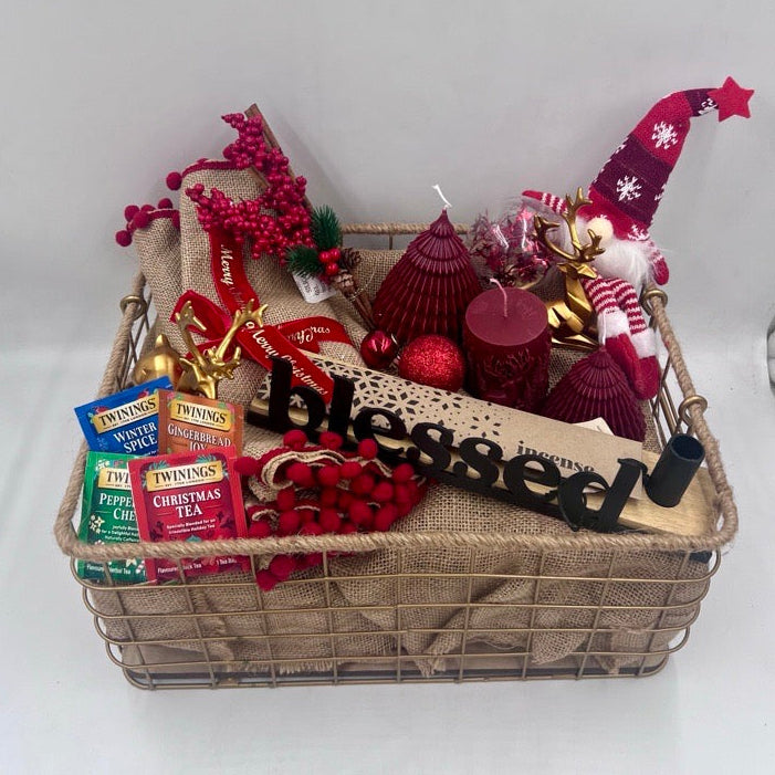 A Metal Hamper including metal incense burner, Christmas red candles, Christmas ornament, table festive runner, 4 tea sachet; gold reindeers